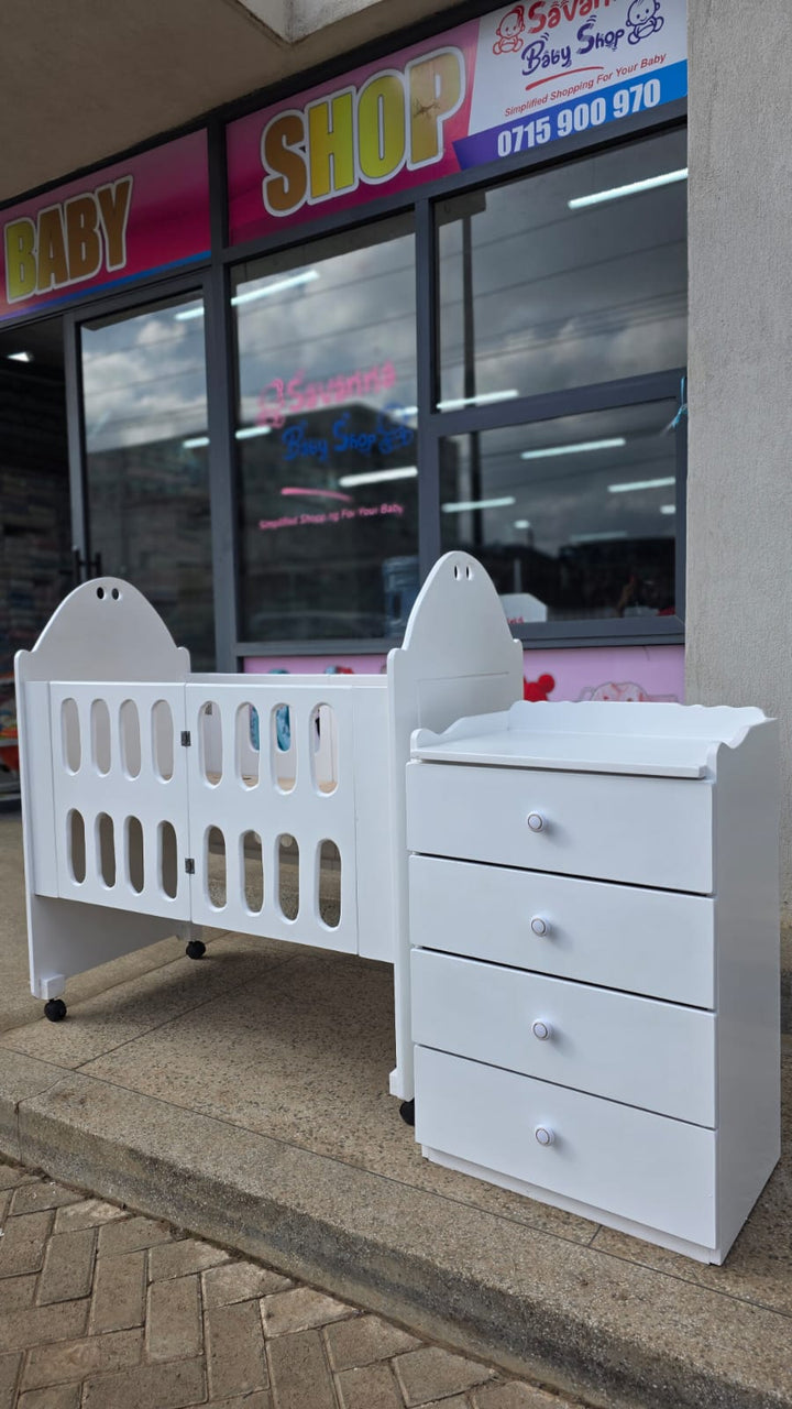2 x 4 Foldable mdf baby cot with 2 x 3 Ft chest of drawers.