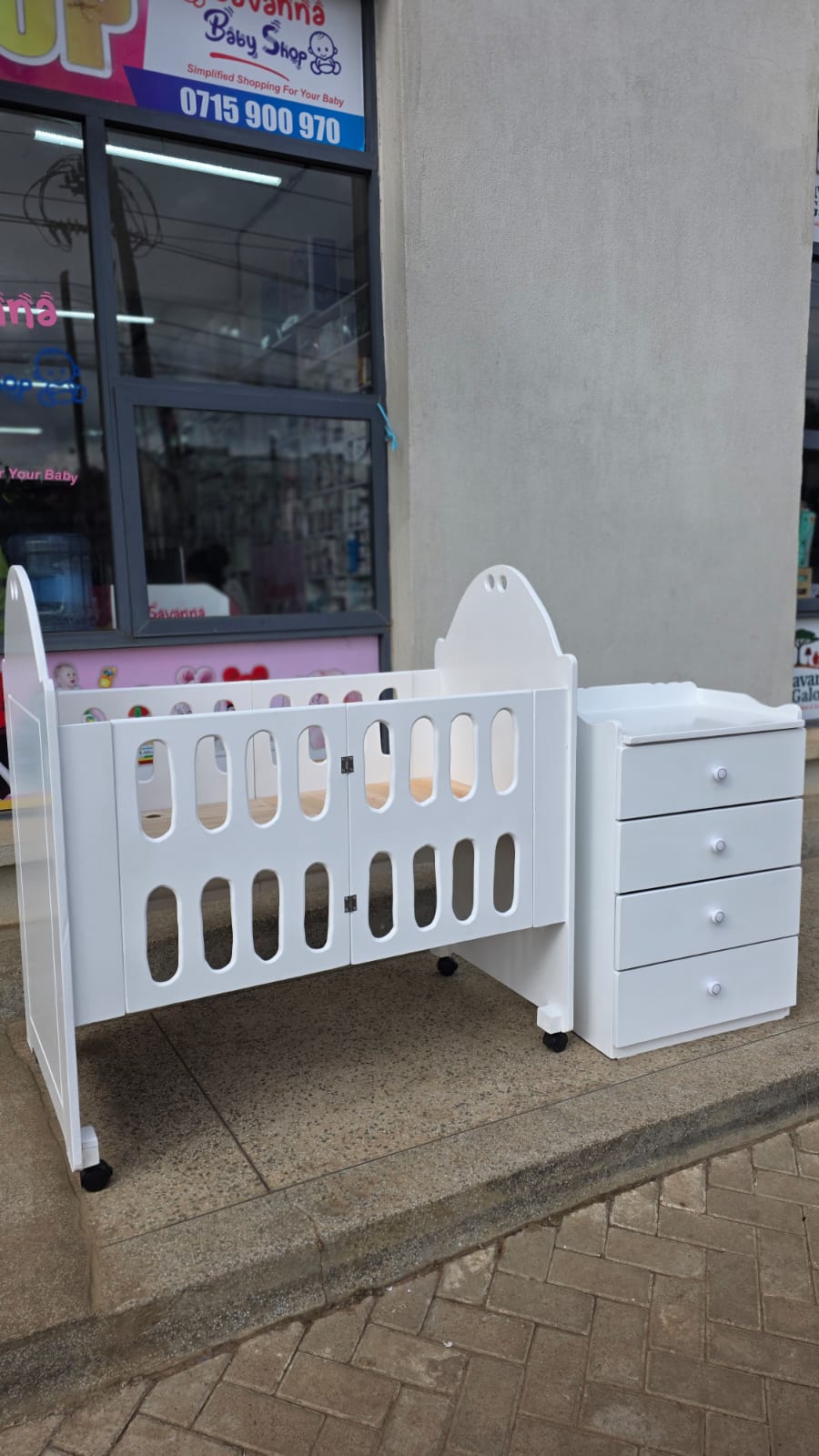 2 x 4 Foldable mdf baby cot with 2 x 3 Ft chest of drawers.