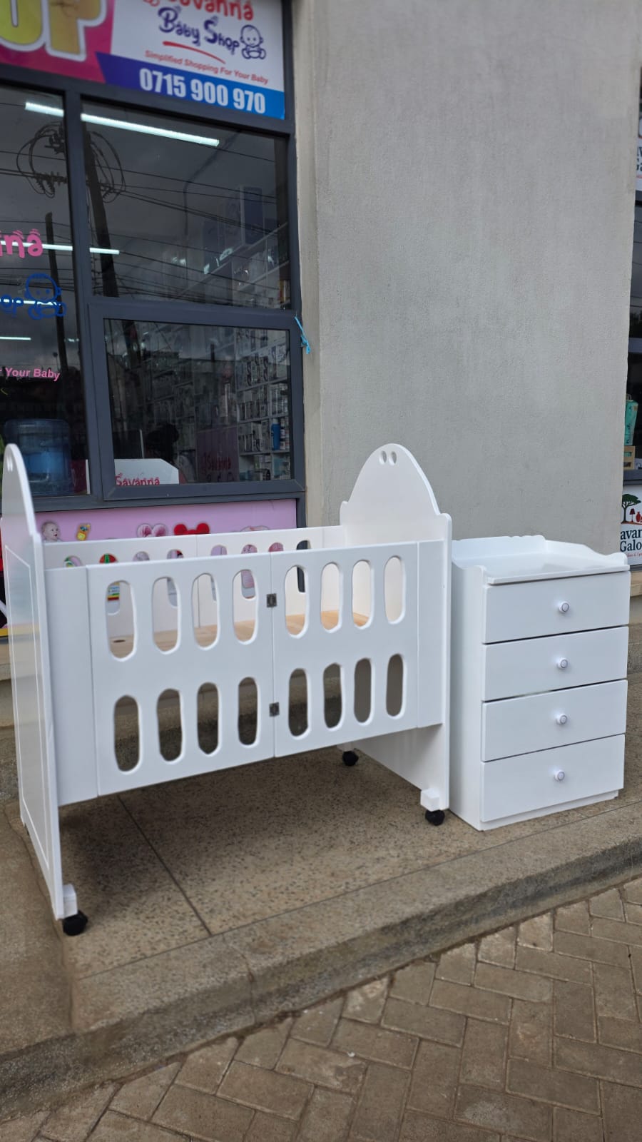 2 x 4 Foldable mdf baby cot with 2 x 3 Ft chest of drawers.